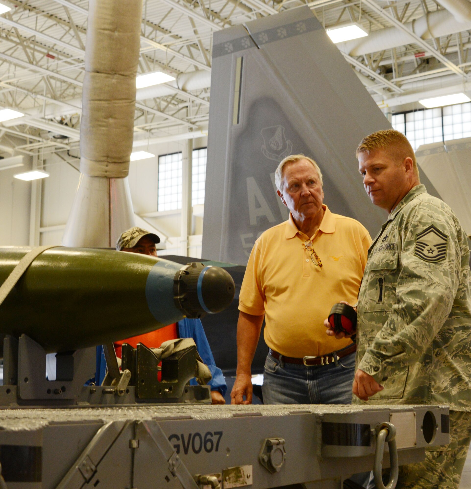 Senior Master Sgt. Ben Dorsey, 477th Aircraft Maintenance Squadron, talks about the GBU-32 with James Thomason, Fort Worth, Texas Air Power Council president. The Air Power Council is a non-profit foundation that raises money in support of our military troops and their families. (U.S. Air Force/Tech. Sgt. Dana Rosso) 