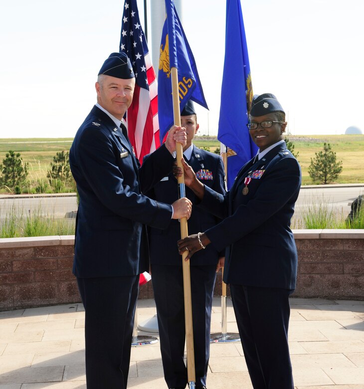 The Mile High Honor Guard presents the colors during the 460th Medical Support Squadron change-of-command ceremony July 11, 2014, at the 460th Space Wing headquarters building on Buckley Air Force Base, Colo. The event signaled Lt. Col. Alvin Scott, 460th MDSS commander, assuming command from Lt. Col. Pamela Smith. (U.S. Air Force photo by Airman 1st Class Samantha Saulsbury/Released)