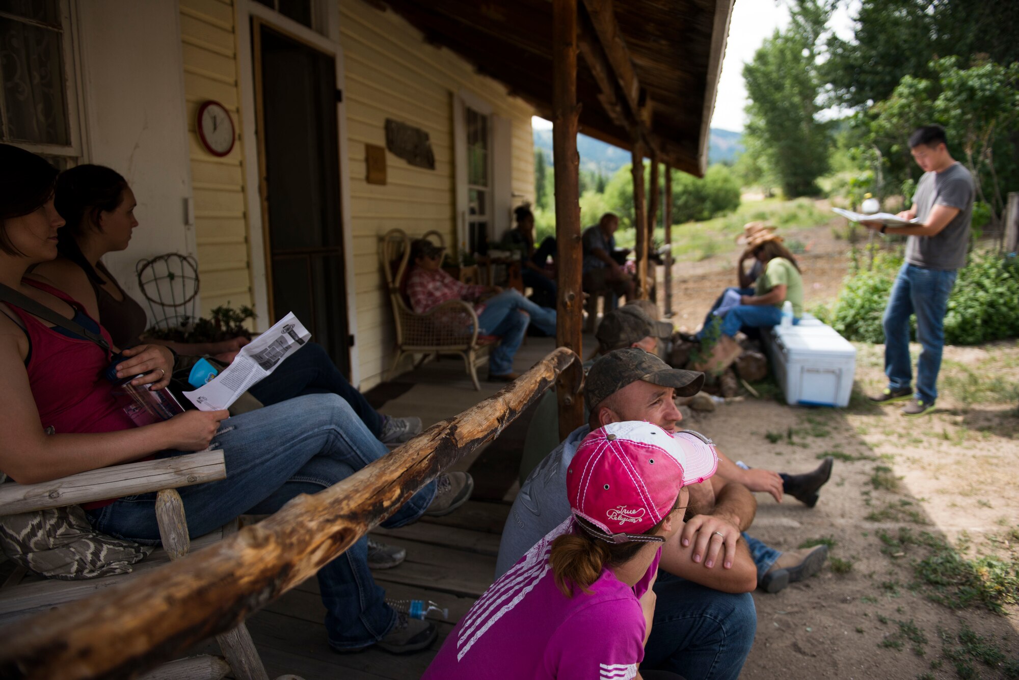 Airmen read their flag pages, a personality inventory, after lunch at Silver Springs, Idaho, July 10, 2014. Airmen had the opportunity to ride horses as well as hike through the surrounding areas to promote resiliency in Airmen’s day-to-day lives. (U.S. Air Force photo by Airman 1st Class Malissa Lott/RELEASED) 