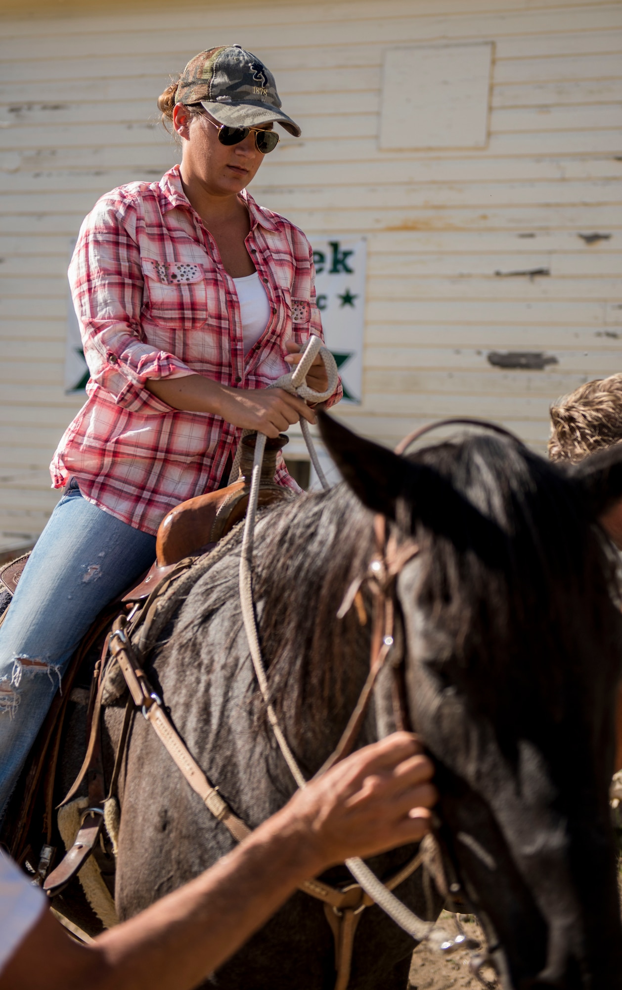 Staff Sgt. Kimberly Miller, 366th Component Maintenance Squadron aircraft fuel systems repair technician, rides a horse through Silver Springs, Idaho, July 10, 2014. The all-day event helped strengthen the resiliency of Airmen at Mountain Home Air Force Base. (U.S. Air Force photo by Airman 1st Class Malissa Lott/RELEASED) 