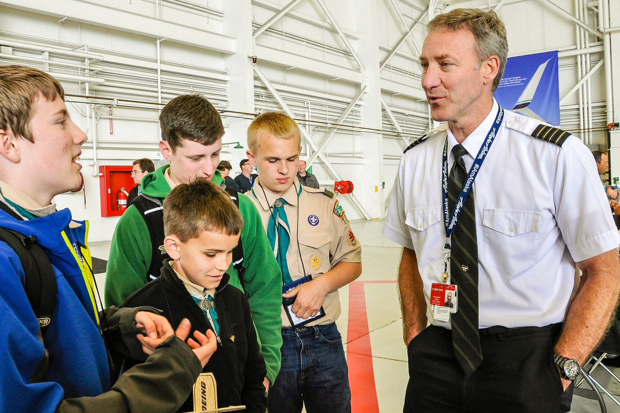 Col. Garin Tentschert, former 97th Airlift Squadron commander out of Joint Base Lewis-McChord, Washington, speaks to a group of Boy Scouts about the pilot career field during Alaska Airlines Aviation Day in Sea-Tac, Washington May 10. Tentschert is also a chief pilot for the airline, responsible for the Portland-Seattle region. He's been flying aircraft with both organizations since 1999. In July 2014, he assumed a Reserve job with the Federal Emergency Management Agency, as an emergency preparedness liaison officer. (photo courtesy Dianne McGinness/Alaska Airlines)