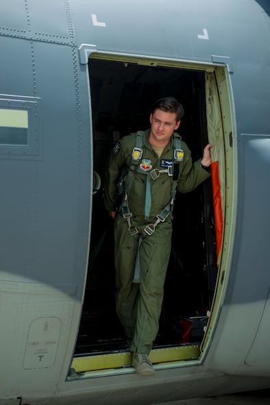 U.S. Air Force Senior Airman Todd Johnson,  71st Rescue Squadron HC-130 J Combat King II loadmaster, ensures his harness is secure at Moody Air Force Base, Ga., July 11, 2014. Johnson uses a harness to safely maneuver while aboard the aircraft. (U.S. Air Force photo by Airman 1st Class Ceaira Tinsley/Released)