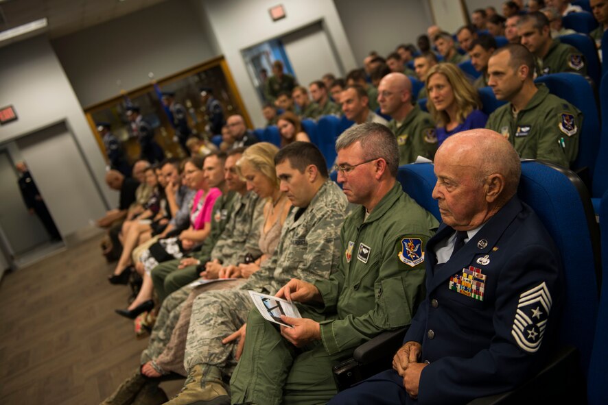 U.S. Air Force retired Chief Master Sgt. Earl Hendrix sits in the audience during the recent retirement ceremony of Lt. Col. Peter Dominicis June 27, 2014 at Moody Air Force Base, Ga. Nearly 30 years after retirement, Hendrix remains actively involved with the base by attending events and speaking to Airmen about his personal experiences in the Air Force. (U.S. Air Force photo by Andrea Jenkins/Released)