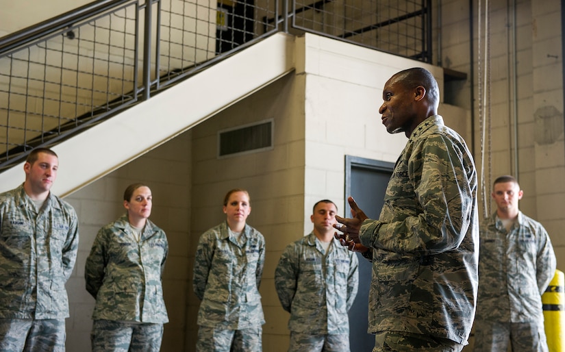 Gen. Darren McDew, Air Mobility Commander commander, speaks to 437th Aerial Port Squadron Airmen about their accomplishments and contributions to the air mobility mission July 11, 2014, at Joint Base Charleston, S.C. The AMC commander interacted with service members, families, Department of Defense civilian employees, contractors and local civic leaders at JB Charleston during his three-day visit. (U.S. Air Force photo/Senior Airman George Goslin)