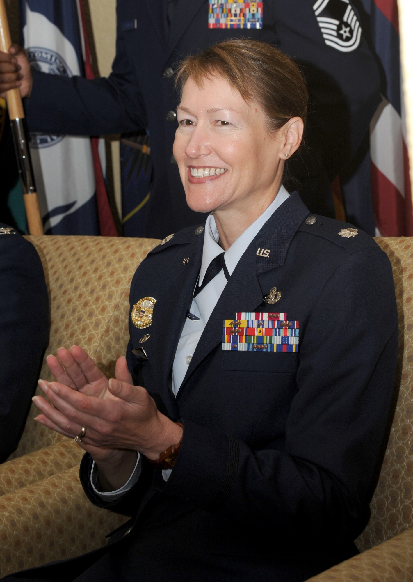 Lt. Col. Susan Airola-Skully, 81st Mission Support Group incoming commander, applauds during the 81st MSG change of command ceremony July 10, 2014, at the Bay Breeze Event Center, Keesler Air Force Base, Miss.  Airola-Skully was previously the deputy director, officer and enlisted personnel management, for the Under Secretary of Defense for Personnel and Readiness, Office of the Secretary of Defense, at the Pentagon.   She replaces Col. Mark Vivians who will be retiring July 11.  (U.S. Air Force photo by Kemberly Groue)