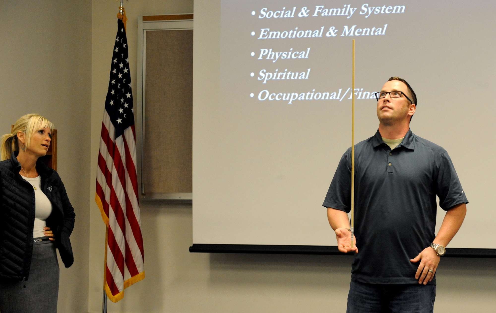 Dr. DeAnn Smetana, 142nd Fighter Wing director of physiological health, watches Tech. Sgt. Brent Neibert, right, 142nd Fighter Wing, participate in an exercise about ‘staying balanced’ during three days of training for Sexual Assault Preventing and Response (SAPR) training, June 24-26, Portland Air National Guard Base, Ore. (U.S. Air National Guard photo by Tech. Sgt. John Hughel, 142nd Fighter Wing Public Affairs/Released)