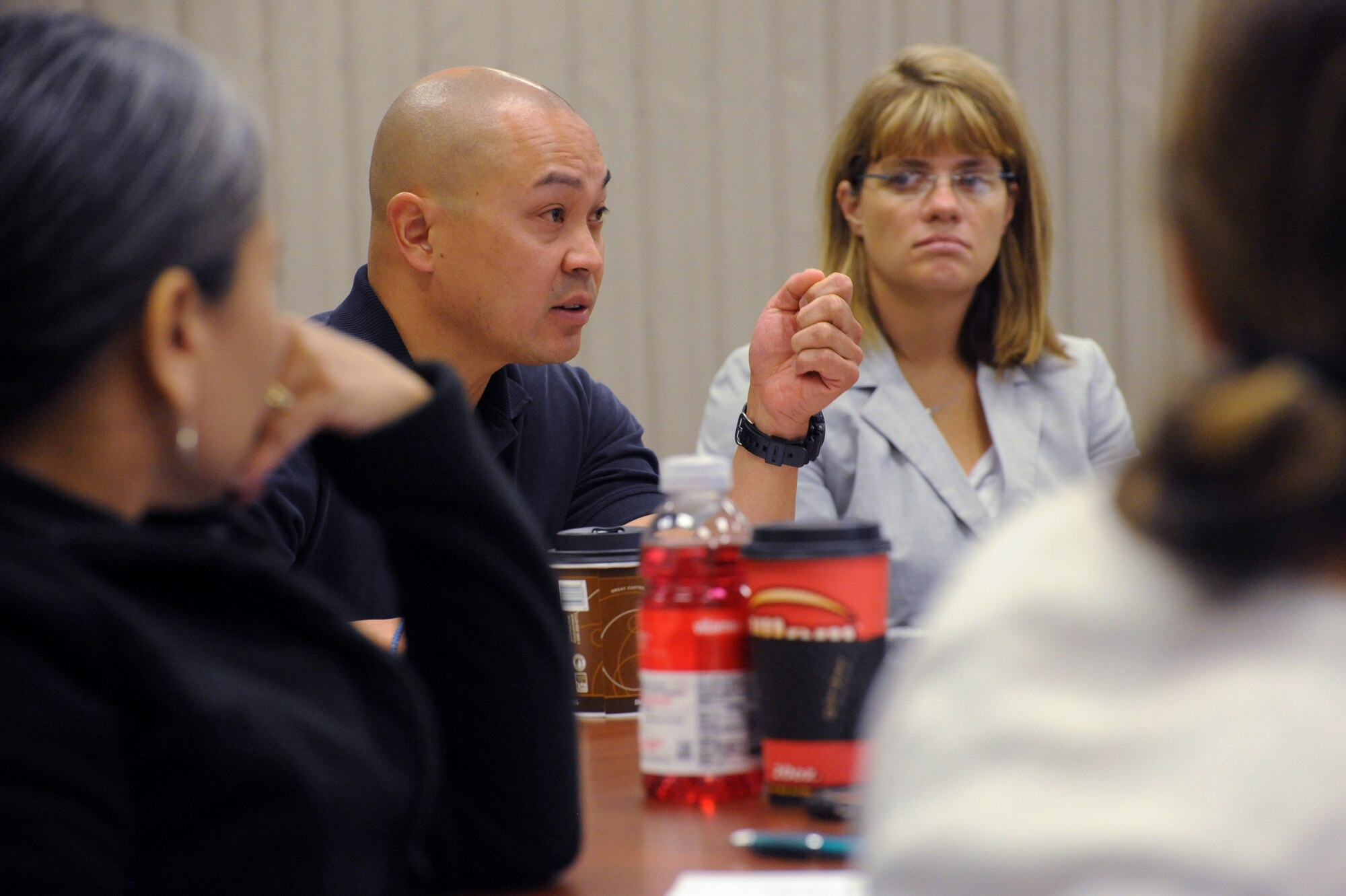 Oregon Army National Guard Capt. Wayne Pong, center left, and other Victim Advocates participate in three days of Sexual Assault Preventing and Response (SAPR) training, June 24-26, Portland Air National Guard Base, Ore. (U.S. Air National Guard photo by Tech. Sgt. John Hughel, 142nd Fighter Wing Public Affairs/Released)