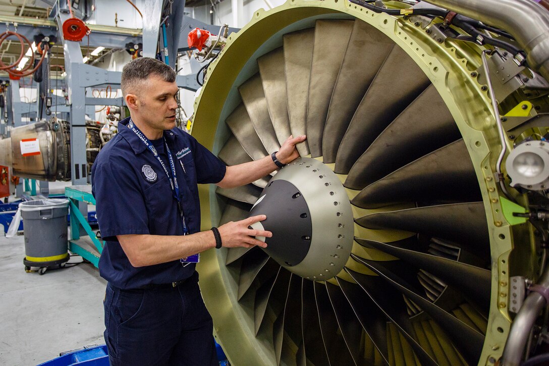 Senior Master Sgt. Marty Hitt, 446th Aircraft Maintenance Squadron, Blue Aircraft Maintenance Unit assistant superintendent at Joint Base Lewis-McChord, Washington, double checks a Boeing 737 aircraft engine to ensured it's been repaired properly, at his day job with Alaska Airlines, as a maintenance technician trainer, April 24. Hitt’s been with both the Air Force Reserve and the airline for the last 16 years. (U.S. Air Force Reserve photo by Jake Chappelle)