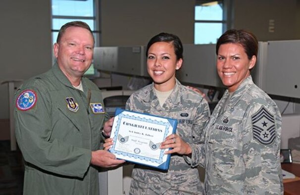 Senior Airman Ashley Jalbert, Air Reserve Personnel Center board operations technician, accepts a certificate of congratulations for making staff sergeant from Brig. Gen. Samuel “Bo” Mahaney, ARPC commander, and Chief Master Sgt. Ruthe Flores, ARPC command chief, July 10 at Buckley Air Force Base, Colo. (U.S. Air Force photo/Master Sgt. Christian Michael)