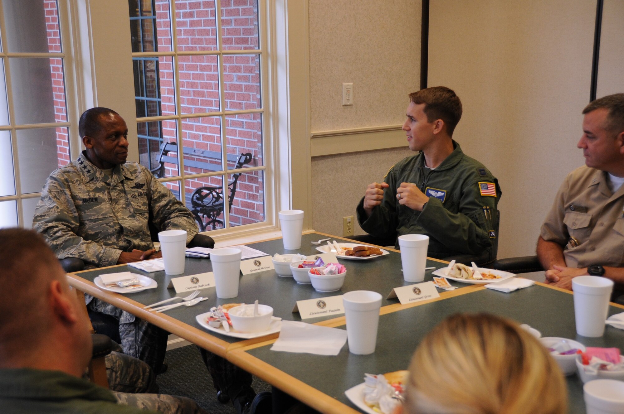 Capt. Adam Bergoo, 14th Airlift Squadron current operations officer (second from right), asks a question for Gen. Darren McDew, Air Mobility Command commander, July 11, 2014, during a breakfast for 20 Joint Base Charleston company grade officers. McDew used this forum to field questions and seek input from JB Charleston’s junior servicemembers while sharing leadership lessons from his 32 years on active duty. The AMC commander interacted with service members, families, Department of Defense civilian employees, contractors and local civic leaders in a variety of venues at JB Charleston during his three-day visit. McDew also previously commanded the 14th Airlift Squadron at Charleston Air Force Base from 1997-1999.  (U.S. Air Force photo/1st Lt. Christopher Love)