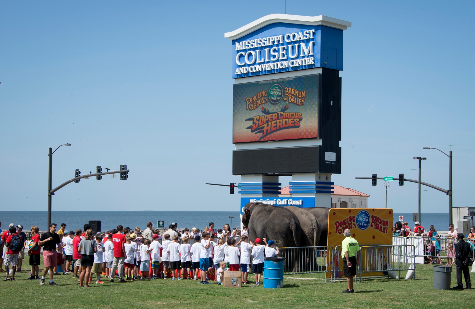 Keesler deployed families watch a performance by elephants during “Pachyderm and Popsicles,” hosted by the Ringling Brothers Circus July 3, 2014, at the Mississippi Coast Coliseum.  The Circus also joined with the Keesler Youth Center to present a banner decorated with Keesler kids’ hand prints and an elephant footprint to the Armed Forces Retirement Home July 2.  (U.S. Air Force photo by Marie Floyd)