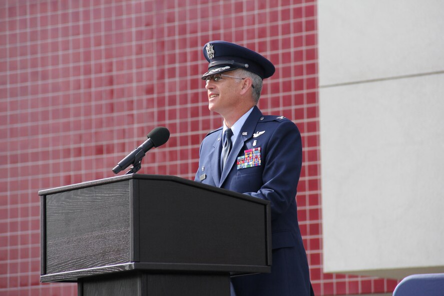 Col. (Dr.) Rawson Wood, 60th Medical Group commander, speaks July 7 at David Grant USAF Medical Center during a change of command ceremony introducing him as the group's new leader (U.S. Air Force photo/Tech. Sgt. Teresa Pineda)
