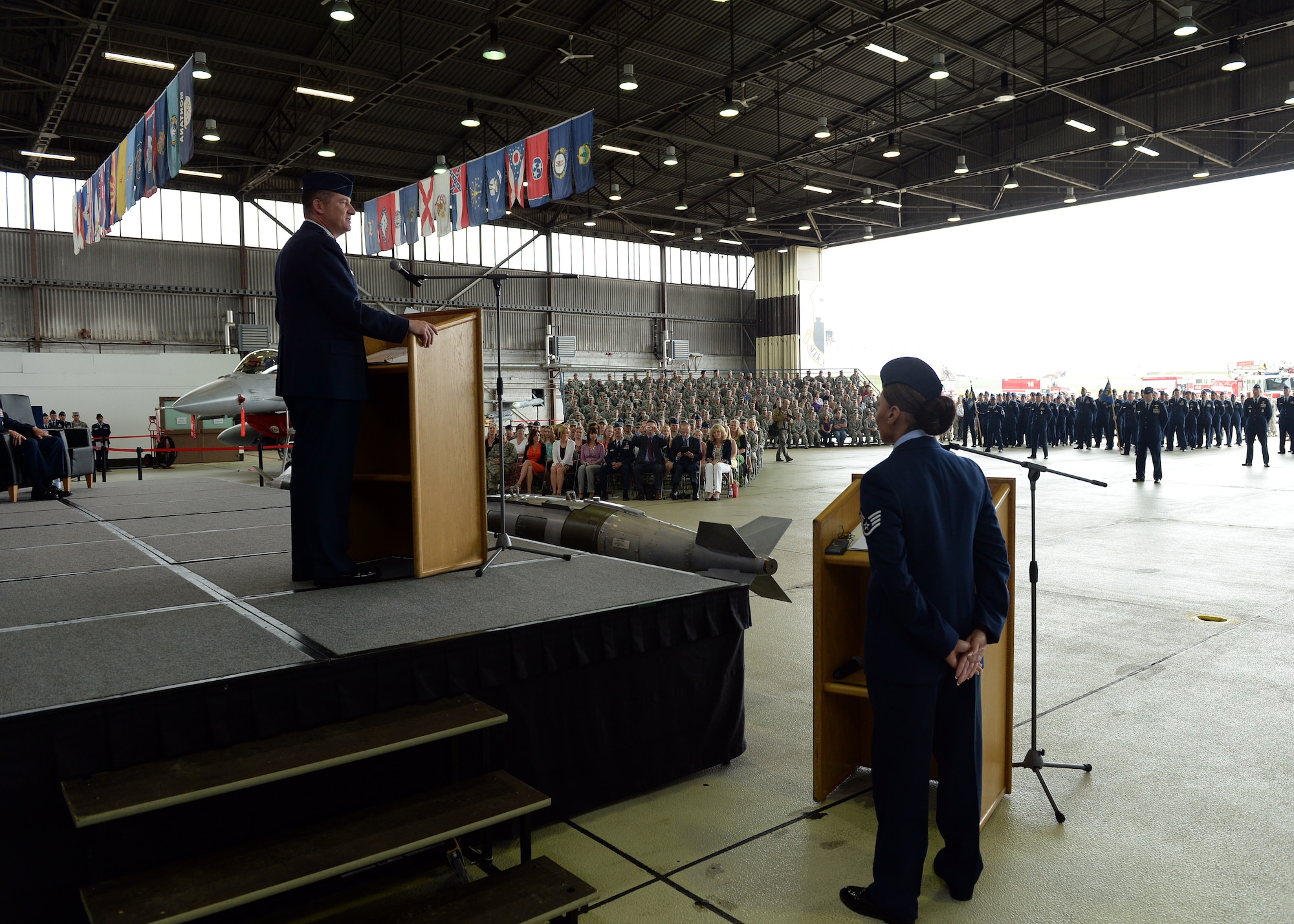 U.S. Air Force Col. Peter Bilodeau, 52nd Fighter Wing commander, addresses his Airmen during an assumption of command ceremony July 11, 2014, at Spangdahlem Air Base, Germany. Bilodeau is a command pilot with more than 3,000 flying hours, including 450 combat hours over Serbia and Iraq in operations Allied Force, Southern Watch, Northern Watch and Iraqi Freedom. (U.S. Air Force photo by Staff Sgt. Daryl Knee/Released)