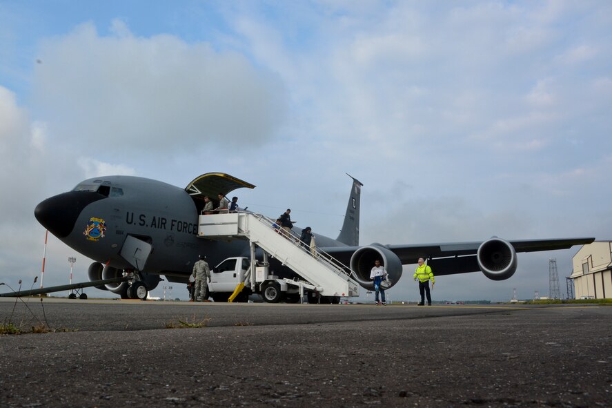 Space available travelers disembark from a KC-135 Stratotanker June 24, 2014, on RAF Mildenhall, England. The flight arrived from Ramstein Air Base, Germany. (U.S. Air Force photo/Senior Airman Micaiah Anthony/Released)