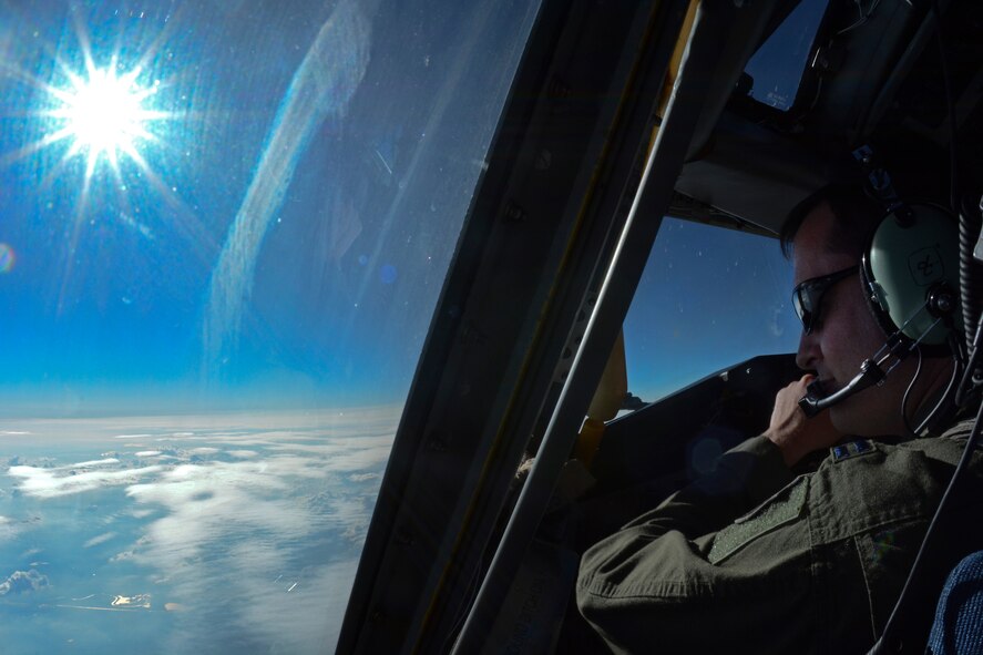 U.S. Air Force Capt. David Clark, 351st Air Refueling Squadron pilot from St. Clair Shores, Mich., looks out a window while flying a KC-135 Stratotanker June 24, 2014 over Germany. Clark and his crew supported three missions in one day, air-to-air refueling, space-available travel and aeromedical evacuation training. (U.S. Air Force photo/Senior Airman Micaiah Anthony/Released)