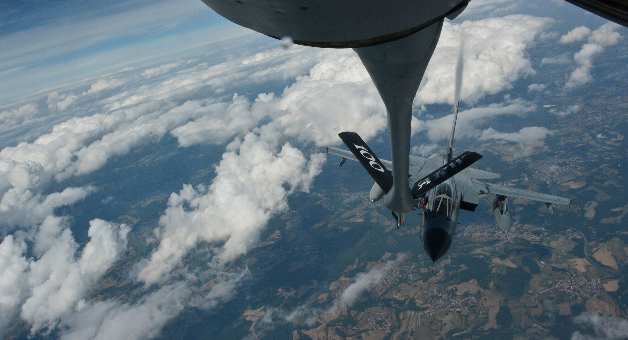 A German Tornado approaches a KC-135 Stratotanker from RAF Mildenhall, England, June 24, 2014, over Germany. Tankers enable the U.S. and its allies the capabilities to maintain air superiority across the globe. (U.S. Air Force photo/Senior Airman Micaiah Anthony/Released)