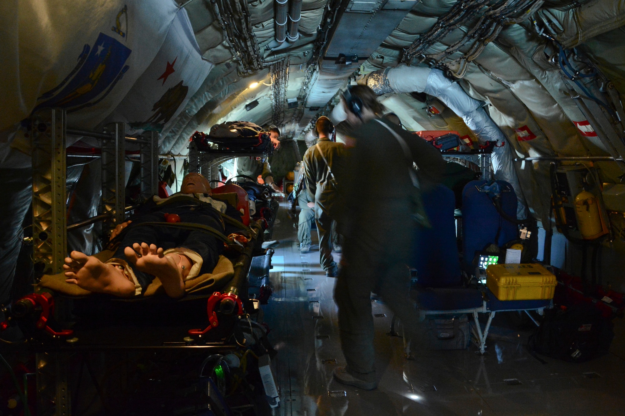 Airmen from the 86th Aeromedical Evacuation Squadron, Ramstein Air Base, Germany, secure their medical equipment June 24, 2014, on a KC-135 Stratotanker over Germany. The crew performed an in-flight emergency and went over several scenarios and tanker statistics to help them prepare for future operations on the KC-135. (U.S. Air Force photo/Senior Airman Micaiah Anthony/Released)