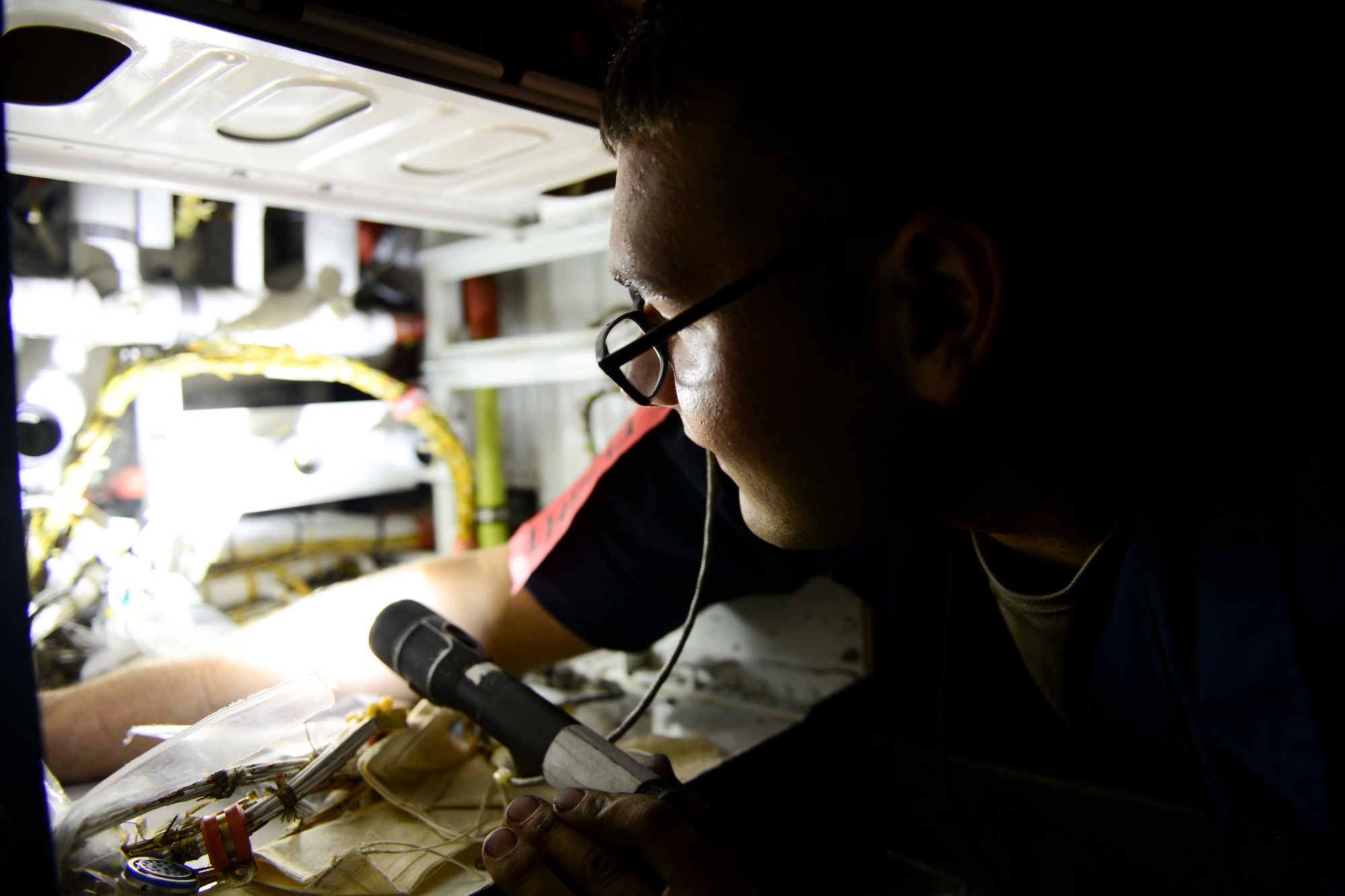 U.S. Air Force Airman 1st Class Montana Biskey, 379th Expeditionary Aircraft Maintenance Squadron, completes maintenance checks on a B1-B Lancer at Al Udeid Air Base, Qatar, July 8, 2014.  The multi-mission B-1 is the backbone of America's long-range bomber force. Biskey is deployed from Ellsworth Air Force Base, South Dakota. (U.S. Air Force photo by Staff Sgt. Ciara Wymbs) 
