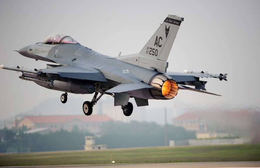 An F-16 Fighting Falcon from the New Jersey Air National Guard takes off for a training sortie as part of the 2014 Theater Security Package at Kunsan Air Base, Republic of Korea, June 10, 2014. New Jersey Air National Guard and District of Columbia National Guardsmen joined the Wolf Pack as part of the TSP that routinely deploys additional fighters, tankers, equipment and personnel to bolster U.S. forces across the Asia-Pacific region. (U.S. Air Force photo by Senior Airman Armando A. Schwier-Morales/Released)