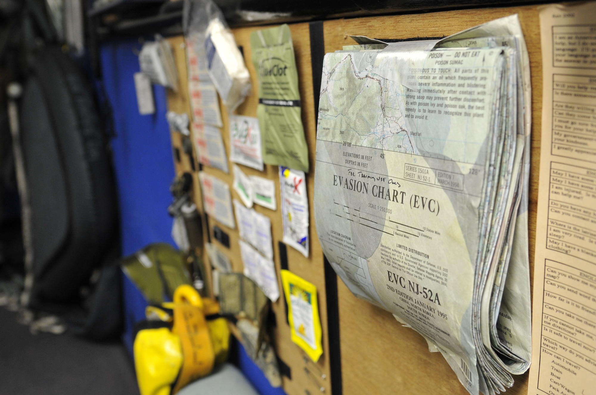 Various survival tools are displayed in the Survival Evasion Resistance and Escape office at the 35th Operations Support Squadron at Misawa Air Base, Japan, June 18, 2014. At the beginning of a SERE instruction course, pilots are briefed on how to utilize items found in a pilot’s survival kit, including water-purifying chemicals, alcohol swabs and local-area maps. (U.S. Air Force photo/Airman 1st Class Patrick S. Ciccarone)