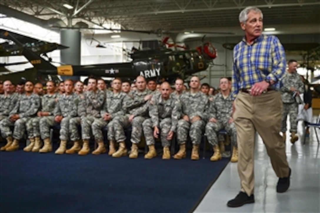 Defense Secretary Chuck Hagel enters the Army Aviation Museum to address soldiers during a question-and-answer session on Fort Rucker, Ala., July 10, 2014. Hagel has been on a two-day trip to visit bases in the South.
