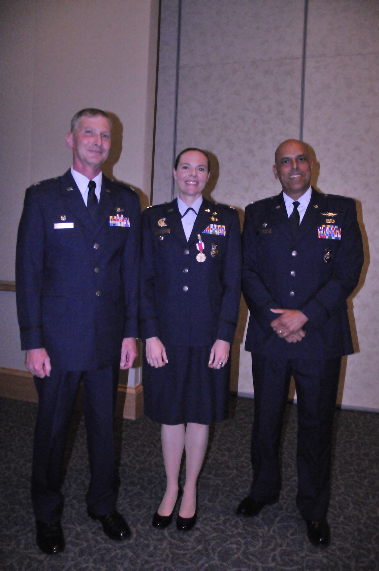 Col. George Raeder (left), mission support group commander, 920th Rescue Wing, Patrick Air Force Base, Fla., former security forces squadron commander Maj. Molly Long (middle) and Capt. Robert Costa (right), security forces squadron commander pose after a change of command ceremony July 12, 2014. Long has been selected for reassignment as an individual mobilization augmentee to the commander of the 50th Security Forces Squadron, Schriever Air Force Base, Colo. P (U.S. Air Force photo/1st Lt. Leslie Forshaw)