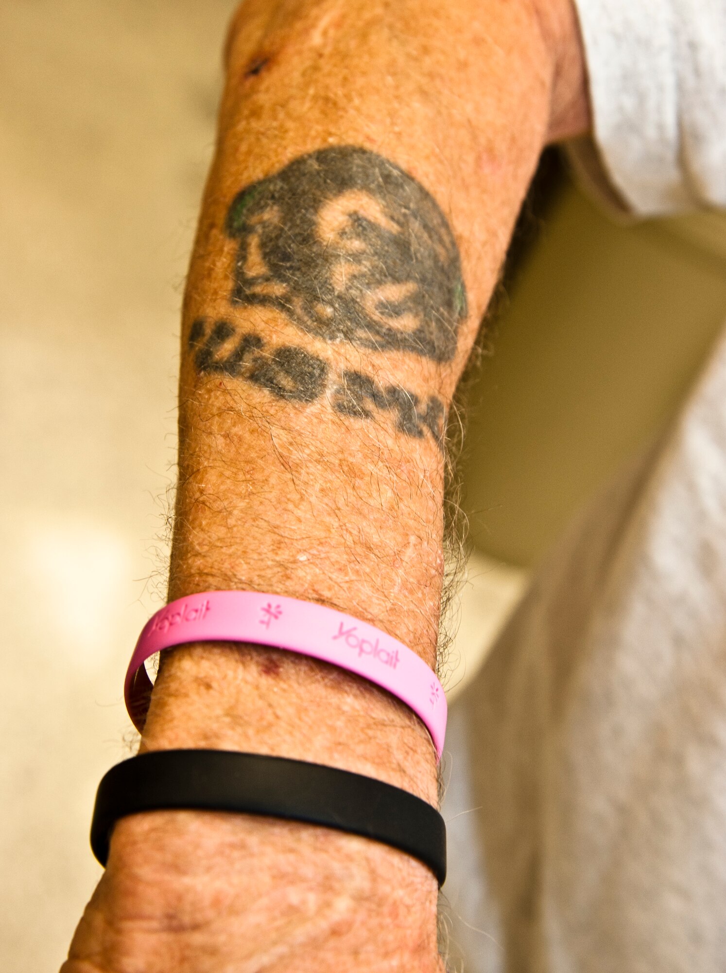Don Magers, retired Marine and Whiteman Commissary bagger, shows his USMC tattoo June 25, 2014. Magers celebrated his 80th birthday this past Independence Day. (U.S. Air Force photo by Senior Airman Daniel Phelps/Released)
