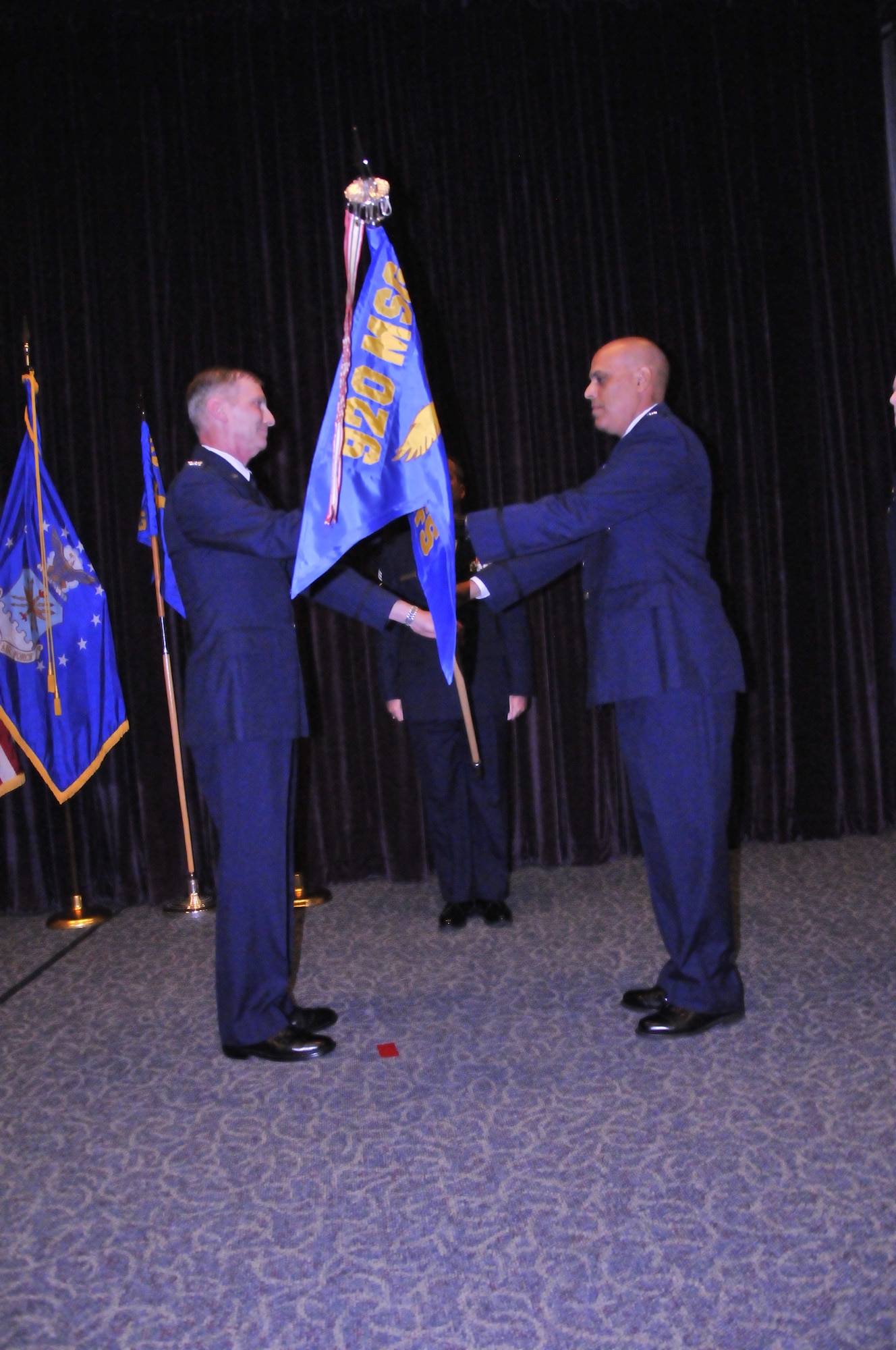 Col. George Raeder, mission support group commander, 920th Rescue Wing, Patrick Air Force Base, Fla., gives command of the 920th Rescue Wing Security Forces Squadron to Capt. Robert Costa during a change of command ceremony July 12, 2014. (U.S. Air Force photo/1st Lt. Leslie Forshaw)