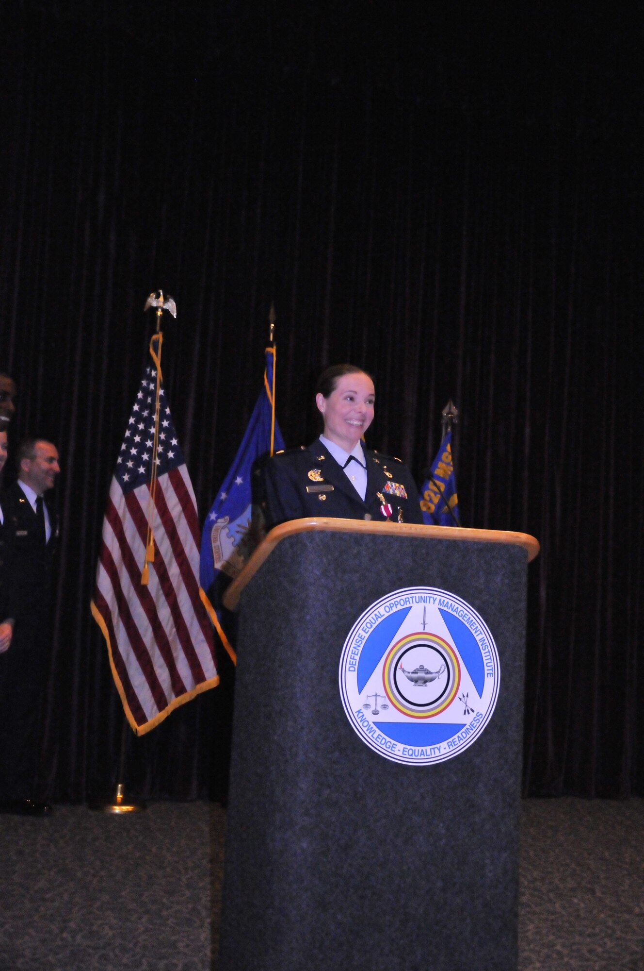 Maj. Molly Long speaks with reservist from the 920th Rescue Wing Security Forces Squadron, Patrick Air Force Base, Fla., about her time as the commander of the security forces squadron before passing leadership to Capt. Robert Costa July 12, 2014. (U.S. Air Force photo/1st Lt. Leslie Forshaw)