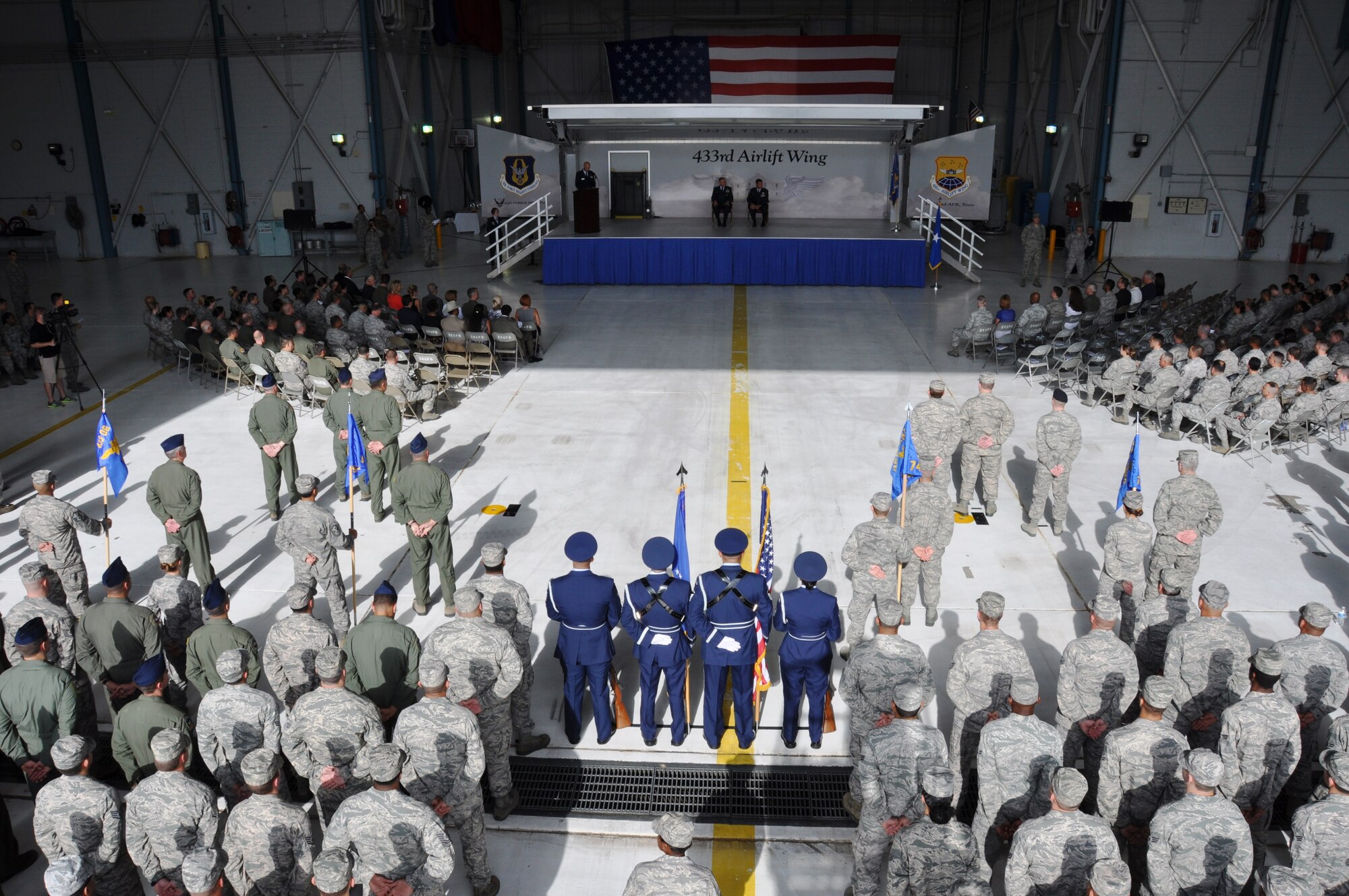 Col. William W. Whittenberger, Jr. assumes command of the 433rd Airlift Wing from Brig. Gen. John C. Flournoy, Jr. 4th Air Force commander, at the 433rd AW's Fuel Cell Hangar, Saturday, July 12, 2014 on Joint Base San Antonio-Lackland, Texas. As commander, Whittenberger will direct the operations and activities of approximately 2,800 people assigned to the wing headquarters and 21 subordinate units. The Alamo Wing is also the home of the Formal Training Unit for all C-5 Galaxy aircrew training.
 (U.S. Air Force photo by Tech Sgt. Carlos J. Trevino)
