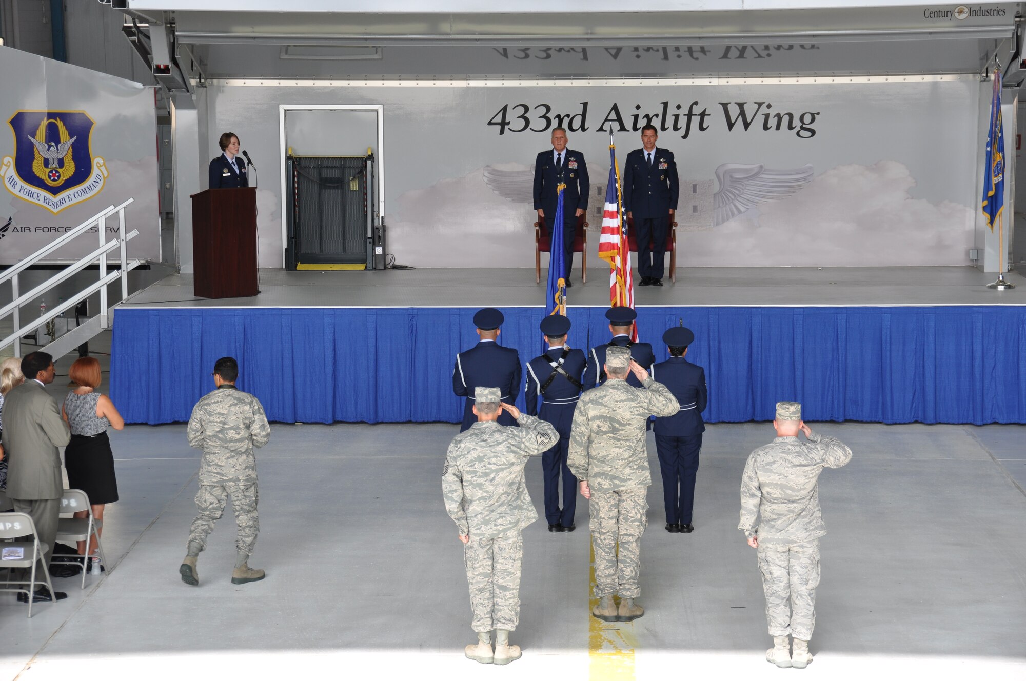 Brig. Gen. John C. Flournoy, Jr. (left), 4th Air Force commander, prepares to pass the command of the 433rd Airlift Wing to Col. William W. Whittenberger, Jr. (right) at Joint Base San Antonio-Lackland, Texas, July 12, 2014. (U.S. Air Force photo by Tech Sgt. Carlos J. Trevino)
