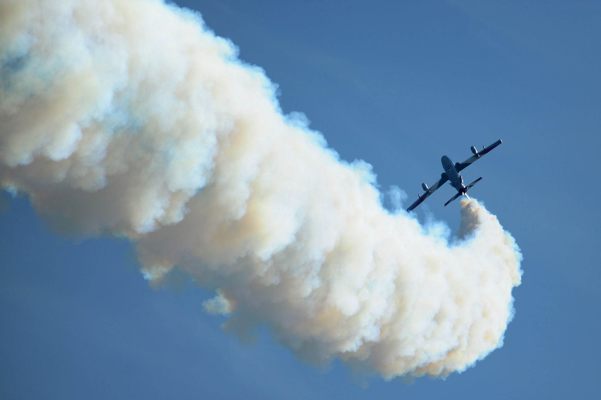 An Italian Air Force Aermacchi AT-339A releases a smoke trail during an aerial demonstration at the 2014 Royal International Air Tattoo on RAF Fairford, United Kingdom, July 12, 2014. This year, RIAT featured numerous international flying spectacles, including aircraft from the United States, United Kingdom and Italy. (U.S. Air Force photo by Staff Sgt. Jarad A. Denton/Released) 
