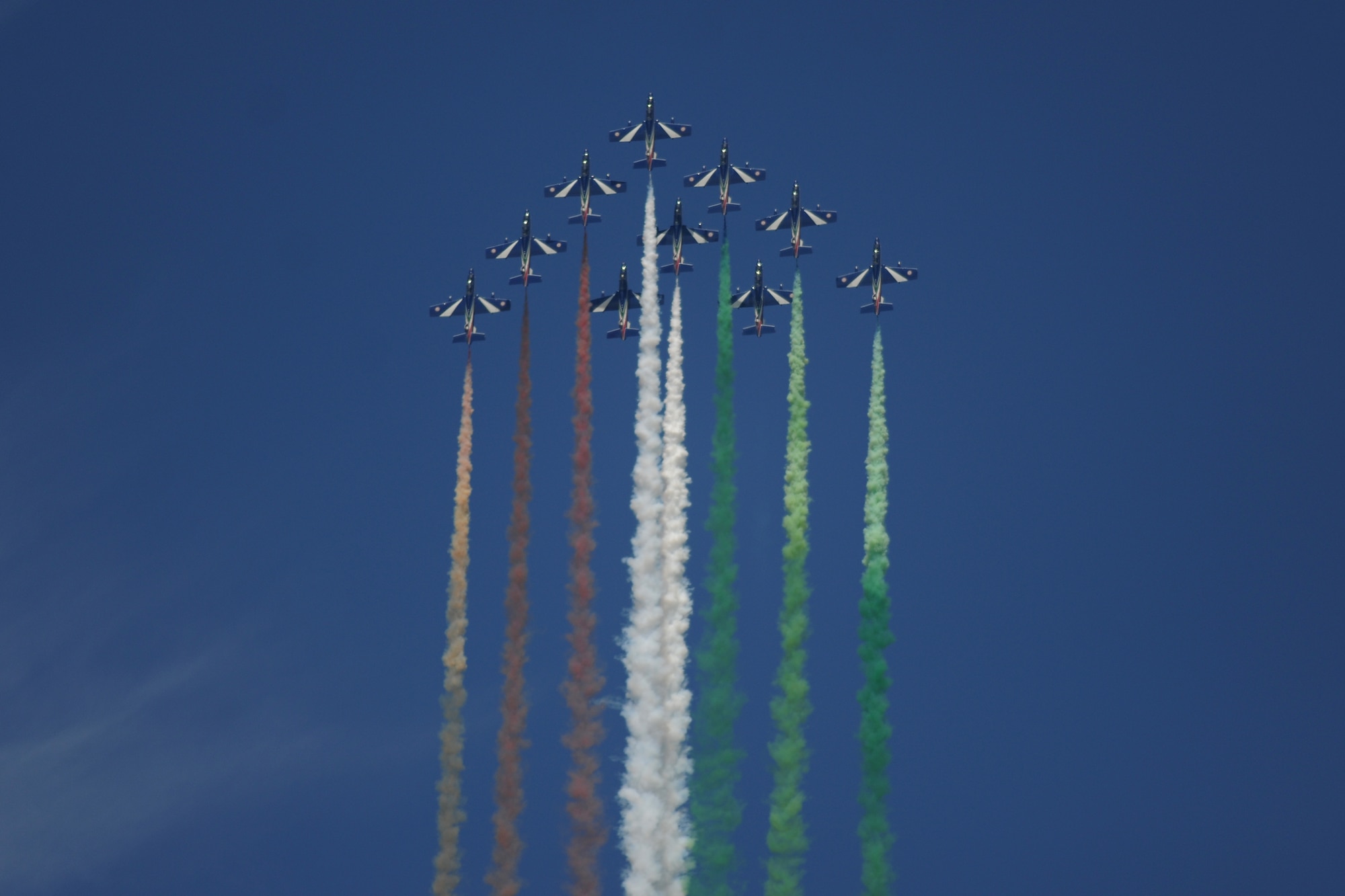 An Italian Air Force Aermacchi AT-339A squadron performs an aerial display during the 2014 Royal International Air Tattoo at RAF Fairford, United Kingdom, July 12, 2014. The demonstration consisted of close flybys, smoke displays and complicated maneuvers. (U.S. Air Force photo by Staff Sgt. Jarad A. Denton/Released) 