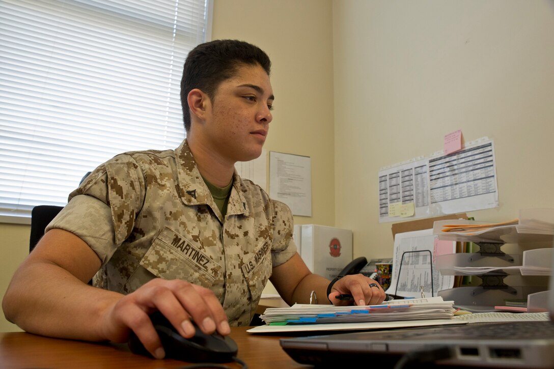 Lance Cpl. Viviana R. Martinez, a Yuba City, California, native, works at her desk July 3 at Camp Foster, Okinawa, Japan. Martinez was recently selected to participate in the Ground Combat Element Integrated Task Force, a battalion comprised of 500 Marines, a fourth of them being females, for a yearlong volunteer program designed to evaluate female Marines under combat arms predeployment conditions. The program will assess how women integrate into combat arms  military occupational specialties. Martinez is slated to report to the School of Infantry-East to begin training July 22 at Camp Lejeune, North Carolina. Martinez is a supply administration and operations specialist with Marine Wing Communications Squadron 18, Marine Air Control Group 18, 1st Marine Aircraft Wing, III Marine Expeditionary Force. 