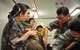 Students from the Republic of Korea Aeromedical Center Primary Flight Nurse Course simulate decontaminating a mock chemical attack casualty during a tour of the 51st Medical Group at Osan Air Base, ROK, July 11, 2014. The nurses represented different branches of the ROK military and used the tour to discuss the similarities and differences of flight nurse responsibilities and training in the ROK and U.S. armed forces. (U.S. Air Force photo/Airman 1st Class Ashley J. Thum)