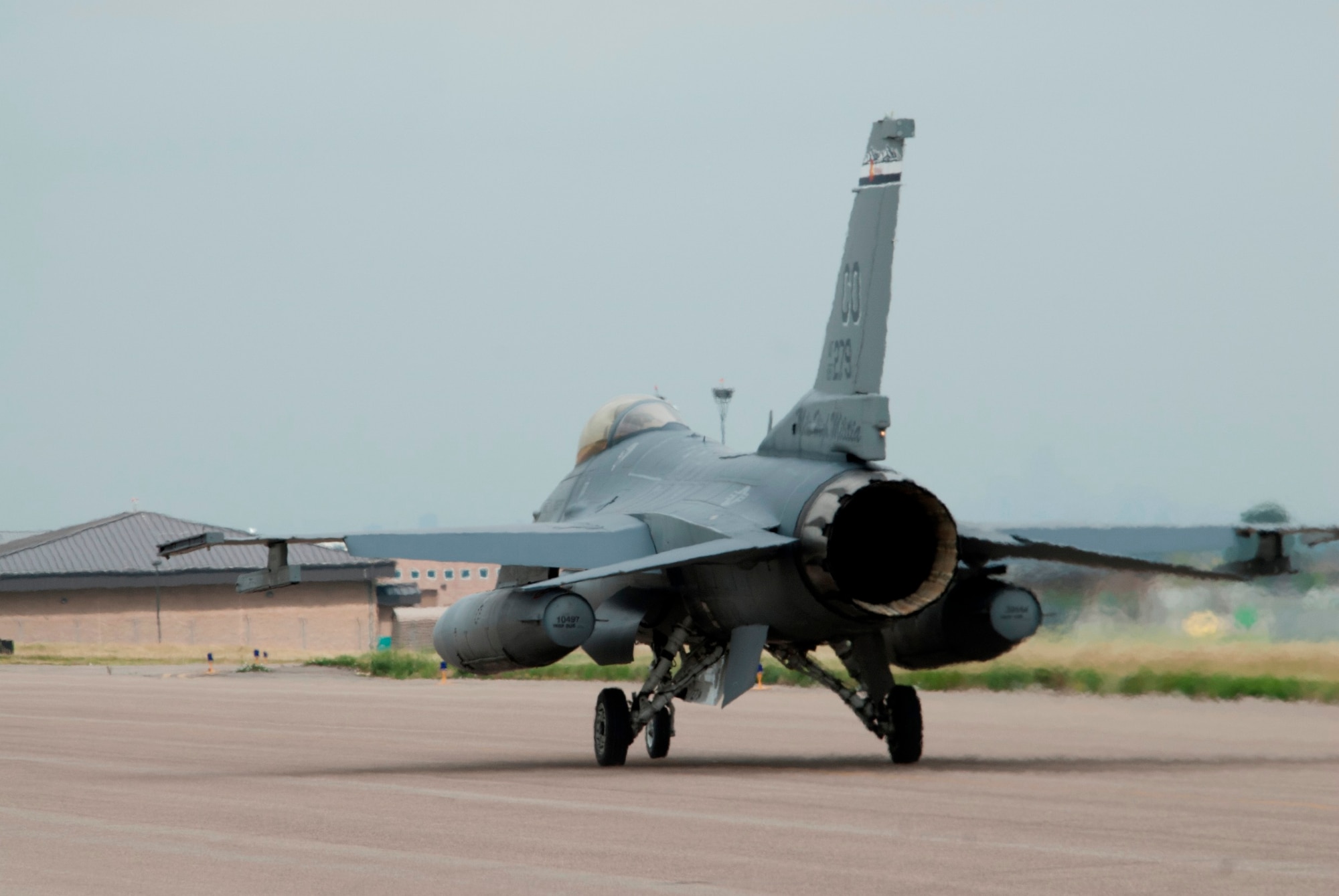 Colorado Air National Guard F-16s return home to Buckley Air Force Base after being housed temporarily at Denver International Airport for the last three months, Buckley AFB, Aurora Colo., July 12, 2014. The partnership between DIA and the COANG  allowed necessary runway reconstruction at Buckley AFB to take place while also providing F-16 pilots the opportunity to continue their 24/7 alert mission and vital training flights twice a day at DIA. Construction on the runway will continue through September, however the airfield is back to operational status. (U.S. Air National Guard photo by Senior Airman Michelle Y. Alvarez-Rea)