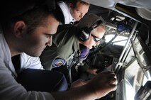 Dario Basnjak, EMC2 and Brent Dewsnup, Goldman Sachs, watch as Master Sgt. Kurt Armstrong, with the Utah Air National Guard, operates the boom during an aerial refueling mission on July 12, 2014, at the Utah Test and Training Range. (U.S. Air Force photo/Senior Airman Allen Stokes)