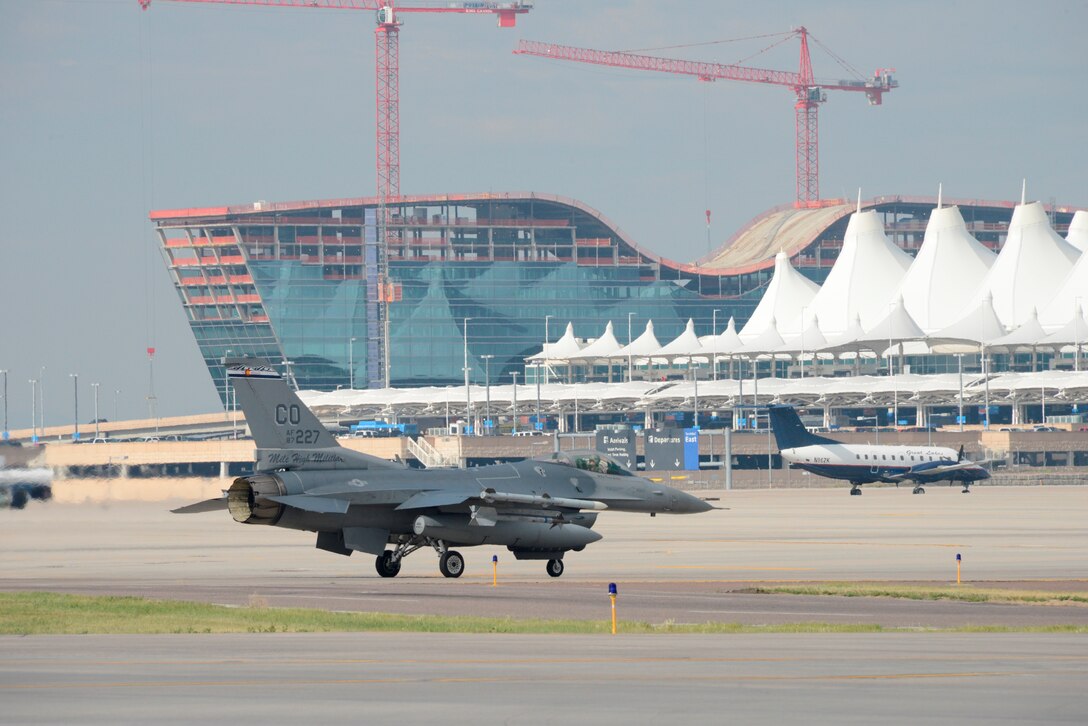 F-16s from the 140th Wing, Colorado Air National Guard begin to return to Buckley Air Force Base July 12, 2014, slightly ahead of schedule, after spending approximately three months at Denver International Airport while the base runway was being reconstructed. Despite relocating their entire flying operations, the wing managed to provide uninterrupted support to their Aerospace Control Alert mission 24/7 throughout the transition to DIA and back to Buckley AFB. (Air National Guard Photo by Tech. Sgt. Wolfram Stumpf) 