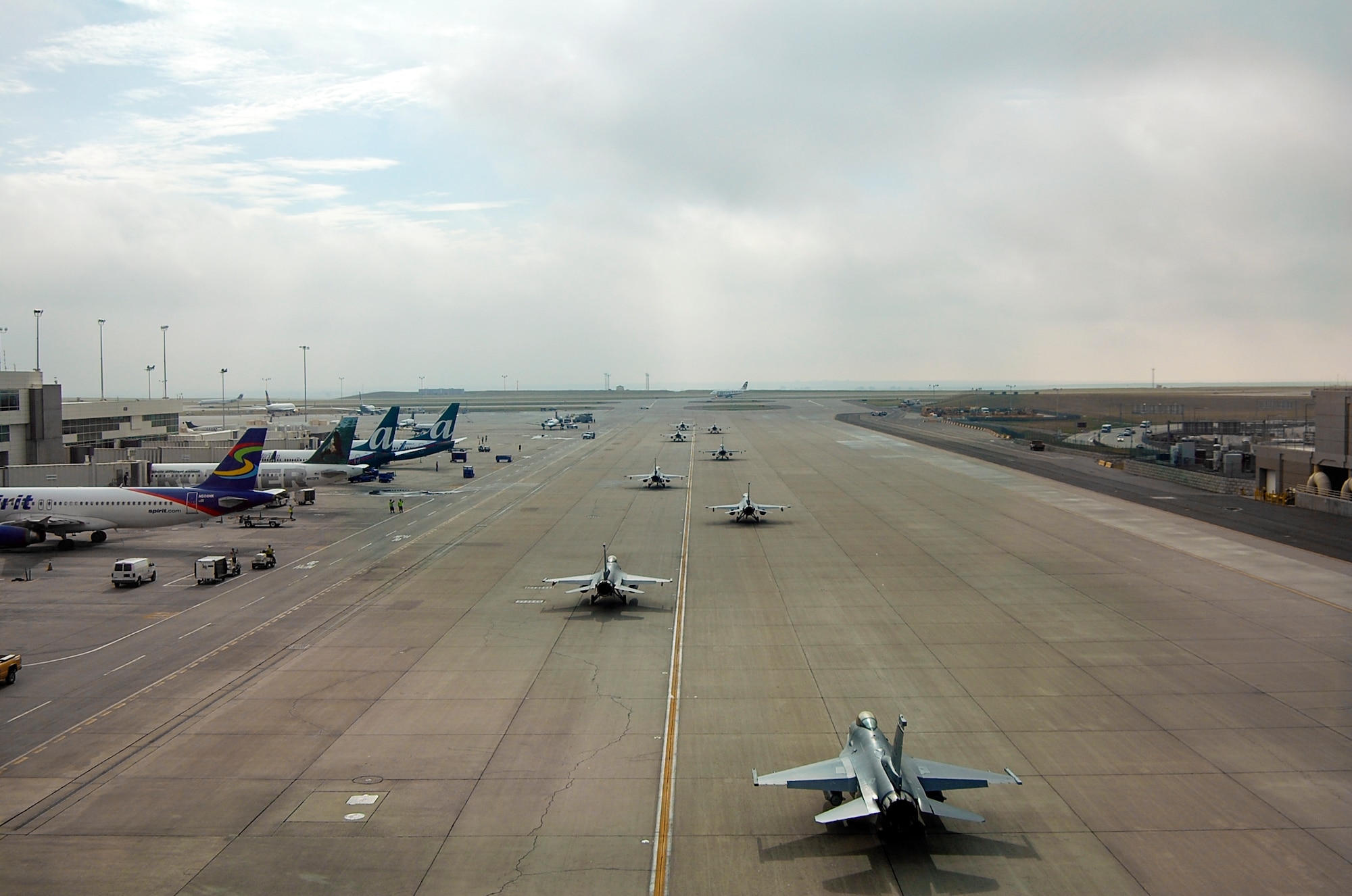 F-16s from the 140th Wing, Colorado Air National Guard begin to return to Buckley Air Force Base July 12, 2014, slightly ahead of schedule, after spending approximately three months at Denver International Airport while the base runway was being reconstructed. Despite relocating their entire flying operations, the wing managed to provide uninterrupted support to their Aerospace Control Alert mission 24/7 throughout the transition to DIA and back to Buckley AFB. (Air National Guard Photo by Capt. Kinder Blacke) 