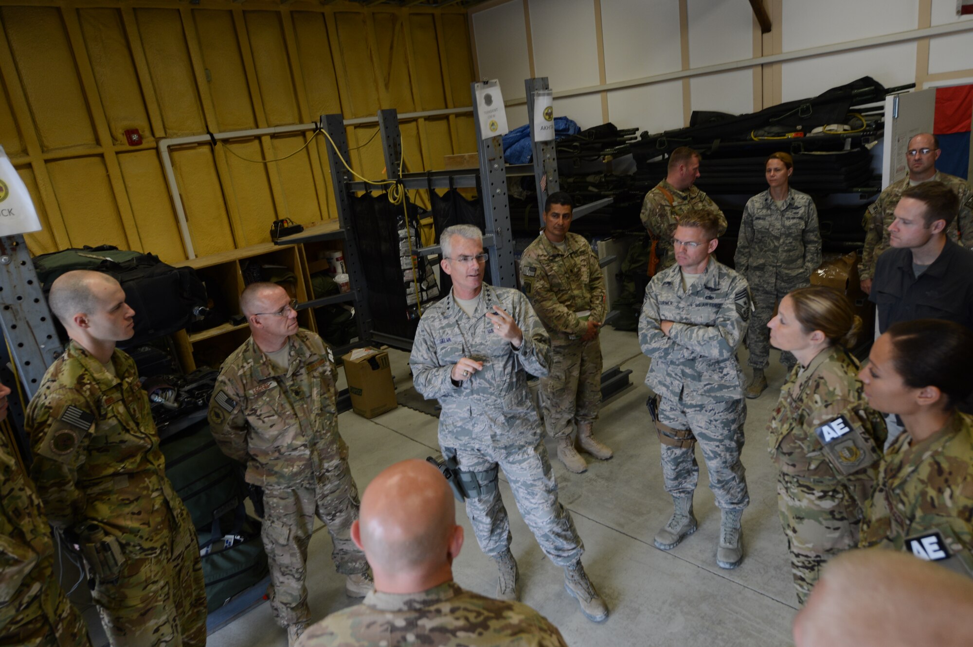 U.S. Air Force General Paul J. Selva, United States Transportation Command commander speaks with Airmen assigned to the 455th Expeditionary Aeromedical Evacuation Squadron at Bagram Airfield, Afghanistan July 10, 2014. Selva spoke with the team about the future of flight medicine and asked members about their concerns in their career field.  (U.S. Air Force photo by Master Sgt. Cohen A. Young/Released)