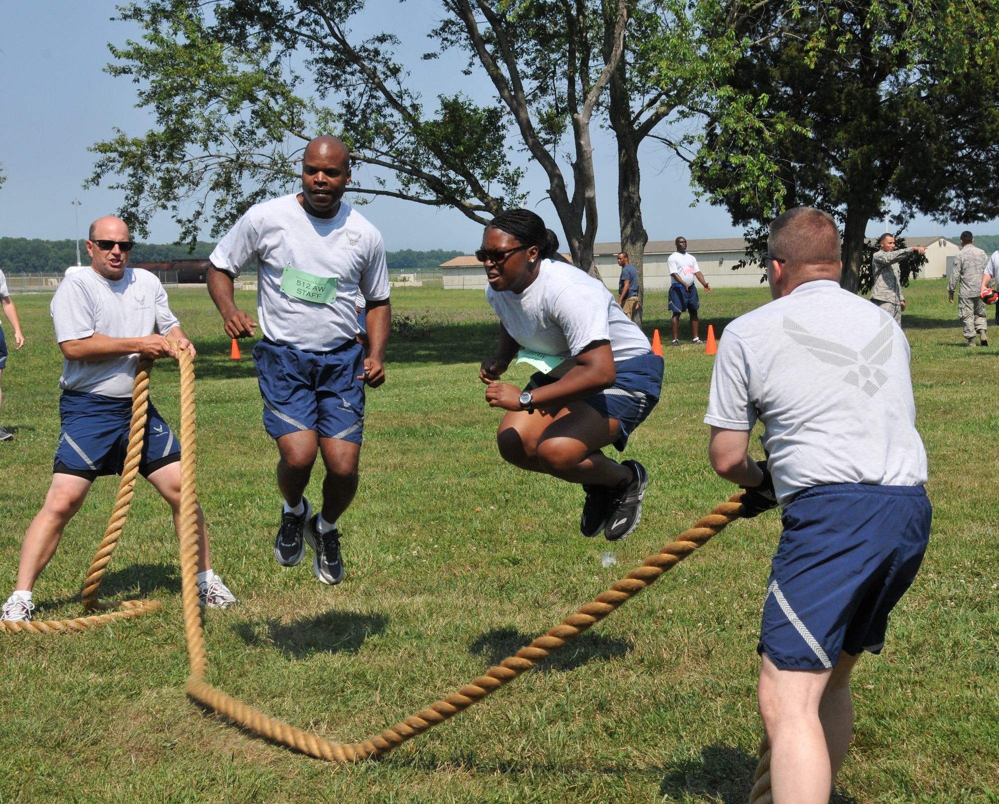 Col. Raymond A. Kozak, 512th Airlift Wing commander, participates in a jump rope competition along with other 512 AW reservists during the wing's Ultimate Fitness Challenge event, July 12, 2014 at Dover Air Force Base, Del. The fitness competition, which was sponsored by wing's Company Grade Office Council, featured other contests like sit-ups, push-ups, a tire flip, and a tug-of-war. (U.S. Air Force photo/Senior Airman Joe Yanik) 