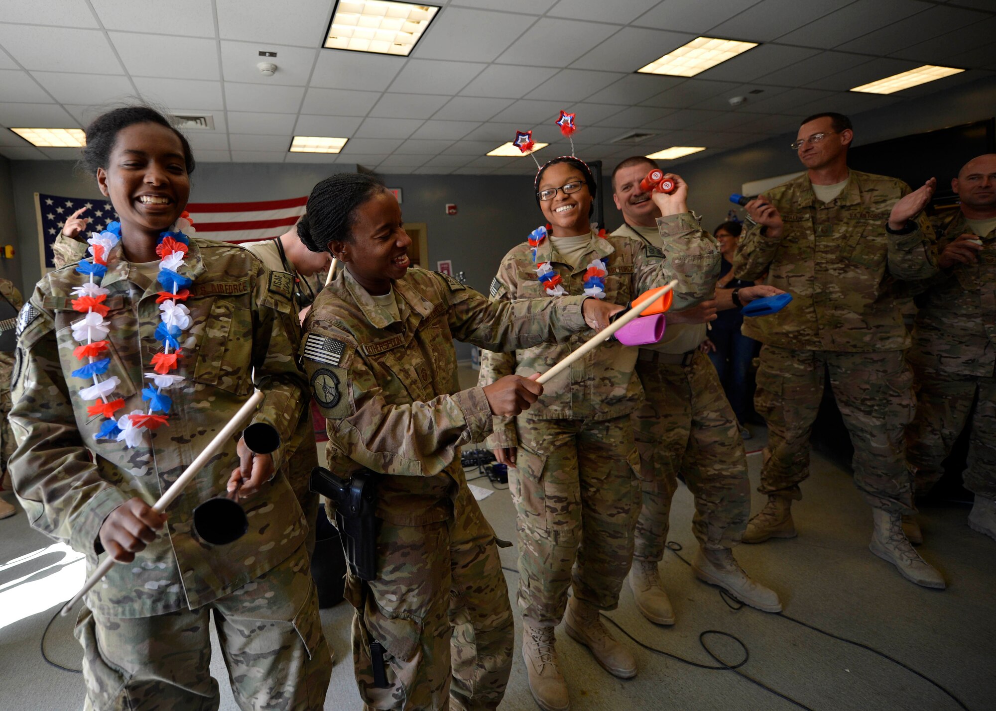U.S. Air Force Airmen play instruments during a performance by the Air Force Central Command band, Starlifter, at Bagram Airfield, Afghanistan July 11, 2014.  The band played at several locations around the airfield to entertain service members. (U.S. Air Force photo by Staff Sgt. Evelyn Chavez/Released)