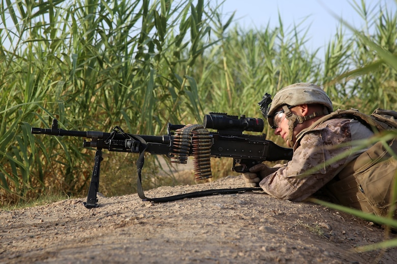 Lance Cpl. Michael Manues, machine gunner, Bravo Company, 1st Battalion, 7th Marine Regiment, provides security with an M240B medium machine gun during a mission in Helmand province, Afghanistan, July 6, 2014. Manues, a native of Pelion, S.C., and the company operated in Gereshk for three days and were involved in numerous kinetic engagements with Taliban insurgents.
(U.S. Marine Corps photo by Cpl. Joseph Scanlan / released)
