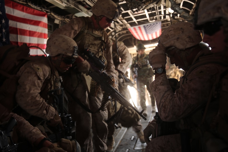 Marines with Bravo Company, 1st Battalion, 7th Marine Regiment, load onto a CH-53E Super Stallion helicopter during a mission in Helmand province, Afghanistan, July 4, 2014. The company operated in Gereshk for three days and was involved in numerous kinetic engagements with Taliban insurgents.
(U.S. Marine Corps photo by Cpl. Joseph Scanlan / released)
