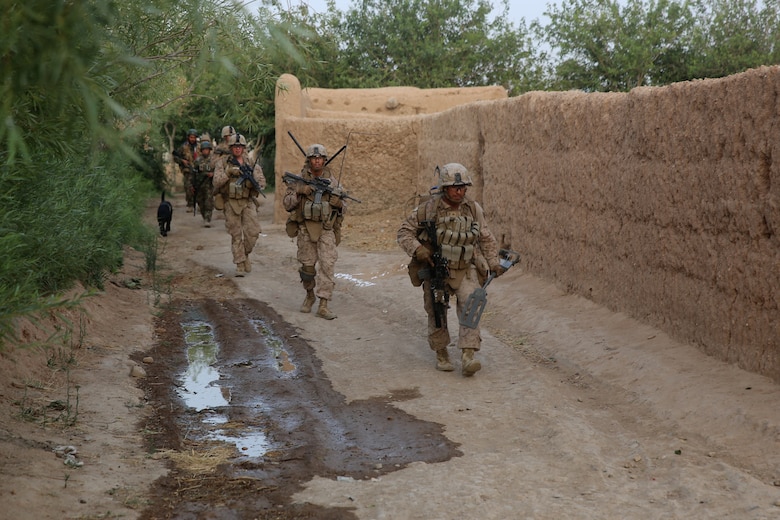 Marines with Bravo Company, 1st Battalion, 7th Marine Regiment, patrol to their next objective during a mission in Helmand province, Afghanistan, July 4, 2014. The company operated in Gereshk for three days and was involved in numerous kinetic engagements with Taliban insurgents.
(U.S. Marine Corps photo by Cpl. Joseph Scanlan / released)
