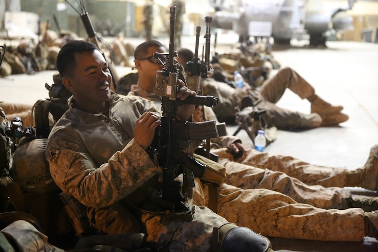 Petty Officer 3rd Class Christian Melendez, corpsman, Bravo Company, 1st Battalion, 7th Marine Regiment, rests next to his gear before a mission in Helmand province, Afghanistan, July 4, 2014. Melendez, a native of El Paso, Texas, and the company operated in Gereshk for three days and were involved in numerous kinetic engagements with Taliban insurgents.
(U.S. Marine Corps photo by Cpl. Joseph Scanlan / released)
