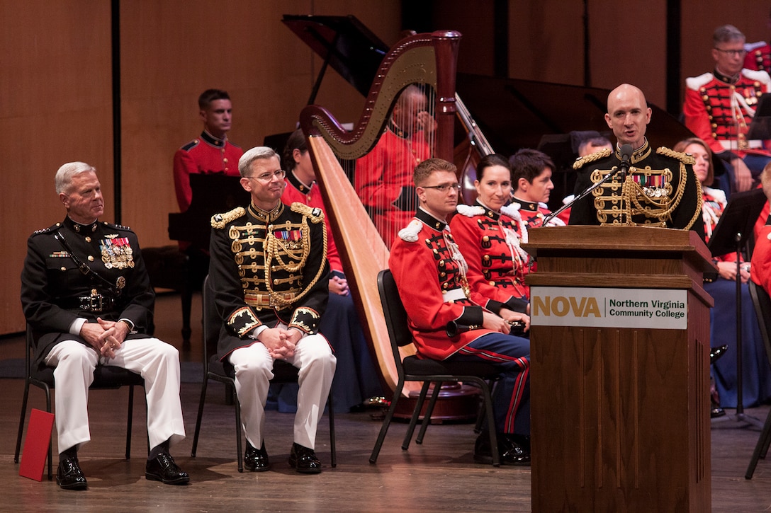 On July 12, 2014, Colonel Michael J. Colburn passed the John Philip Sousa Baton and command of “The President’s Own” United States Marine Band to Assistant Director Lt. Col. Jason K. Fettig. Following the ceremony Col. Colburn retired after serving 27 years in the Marine Corps. Pictured, newly appointed Director Lt. Col. Jason K. Fettig addresses the crowd. (U.S. Marine Corps photo by Staff Sgt. Brian Rust/released)