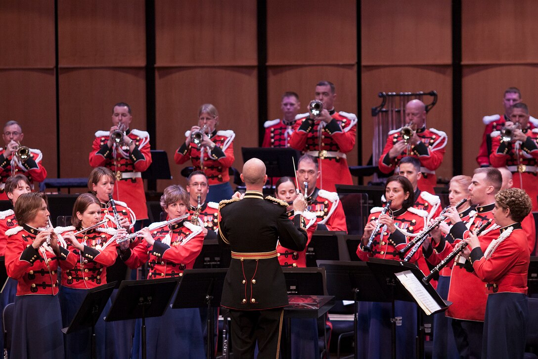 On July 12, 2014, Colonel Michael J. Colburn passed the John Philip Sousa Baton and command of “The President’s Own” United States Marine Band to Assistant Director Lt. Col. Jason K. Fettig. Following the ceremony Col. Colburn retired after serving 27 years in the Marine Corps. Pictured, Lt. Col. Fettig conducting The Marines' Hymn. (U.S. Marine Corps photo by Staff Sgt. Brian Rust/released)