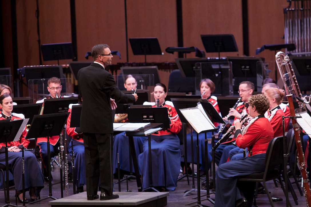 On July 12, 2014, at Rachel M. Schlesinger Concert Hall and Arts in Alexandria, Va., Colonel Michael J. Colburn passed the John Philip Sousa Baton and command of “The President’s Own” United States Marine Band to Assistant Director Lt. Col. Jason K. Fettig. Following the ceremony Col. Colburn retired after serving 27 years in the Marine Corps. Pictured, 26th Marine Band Director Col. Timothy W. Foley, USMC (Ret.) conducts Felix Mendelssohn's Overture in C for Winds, Opus 24. (U.S. Marine Corps photo by Staff Sgt. Brian Rust/released) 