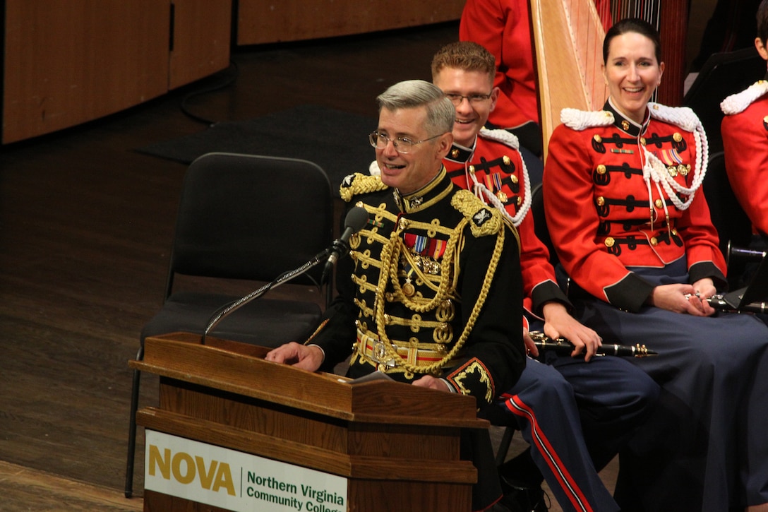 On July 12, 2014, Colonel Michael J. Colburn passed the John Philip Sousa Baton and command of “The President’s Own” United States Marine Band to Assistant Director Lt. Col. Jason K. Fettig. Following the ceremony Col. Colburn retired after serving 27 years in the Marine Corps. Pictured, Col. Colburn addresses the crowd following his retirement. (U.S. Marine Corps photo by Master Sgt. Kristin duBois/released)